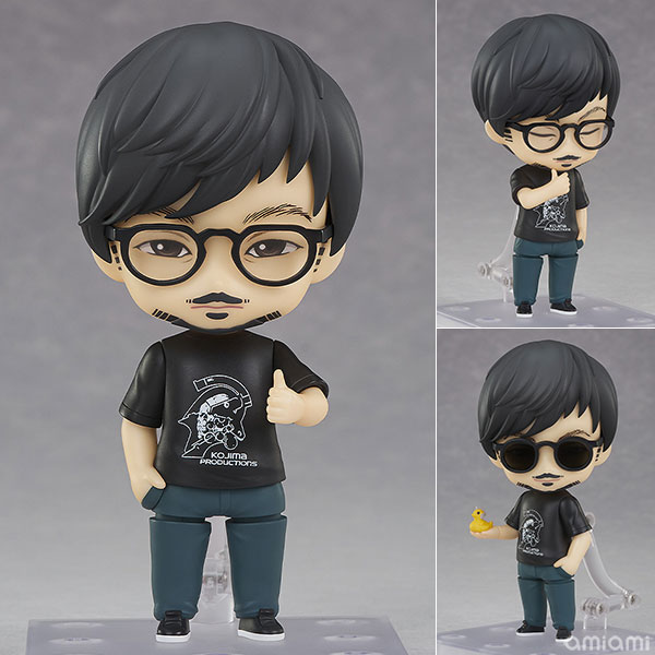 Nendoroid Hideo Kojima tampak depan dengan wajah serius dan kacamata hitam
