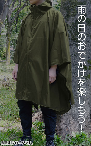 Man Braves Rain at Music Festival in Blue Poncho Stock Image